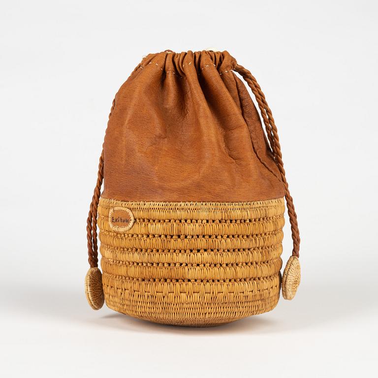 A birch root and leather bag by Ellen Kitok-Andersson.