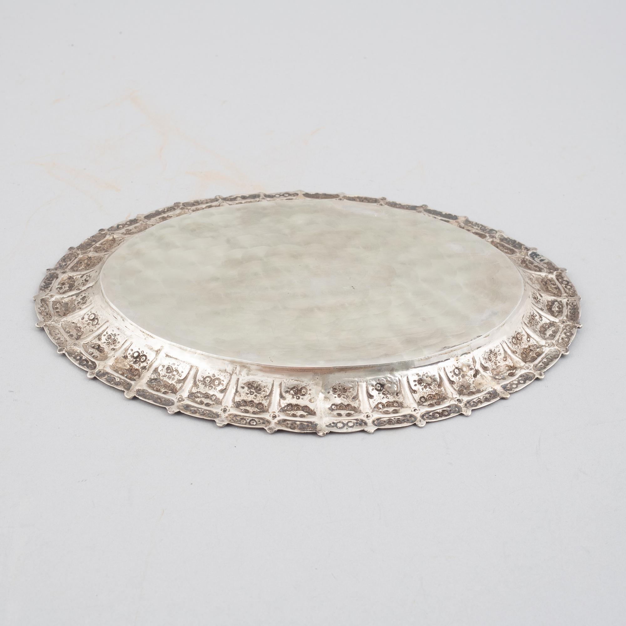 E.Jäntti, four silver cups, a three-piece silver coffee service and a silver tray, Helsinki, Finland,1979-81.