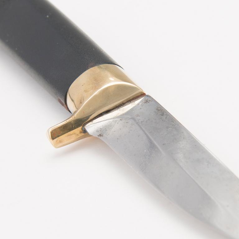 A 1970s Finnish puukko knife in stainless steel, nylon and brass designed by Tapio Wirkkala, Lapin Puukko.
