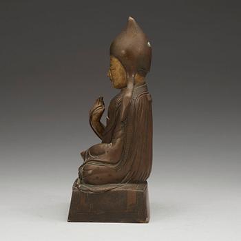A seated bronze figure of a Lama, Sino-Tibetan, 18th/19th  Century.