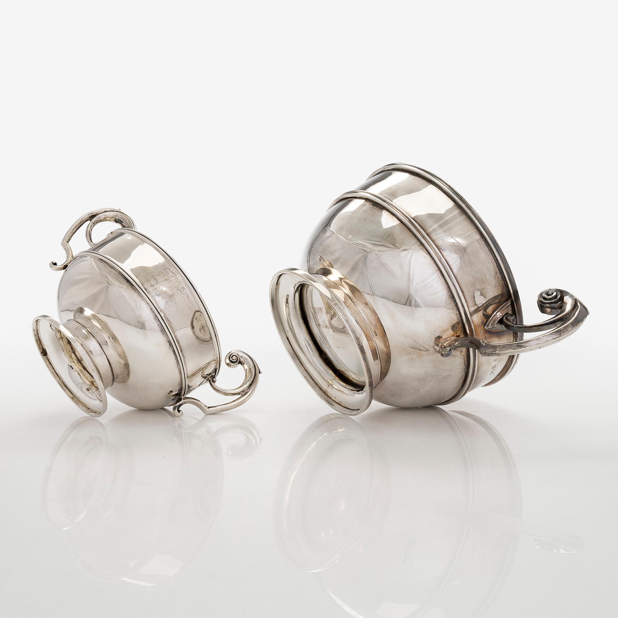 A set of two bowls with handles, sterling silver, England.