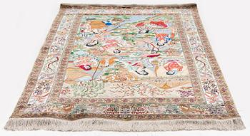 A silk Qum rug, Central Persia, signed, c. 135 x 208 cm.