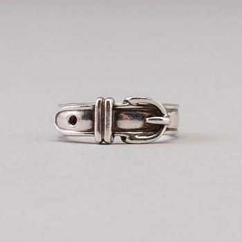 A silver ring by Hermès.