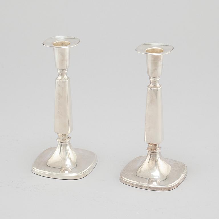 A pair of silver candlesticjs by Tore Eldh for K&EC in Gotheburg, 1970.