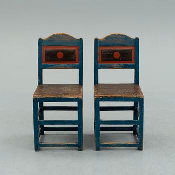 a pair of early 20th century chairs.