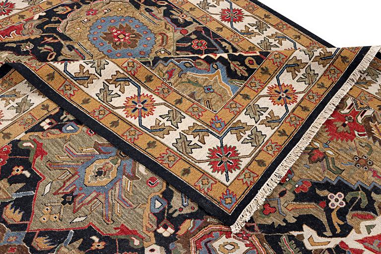 An oriental carpet with Mamluk design, c. 364 x 276 cm.