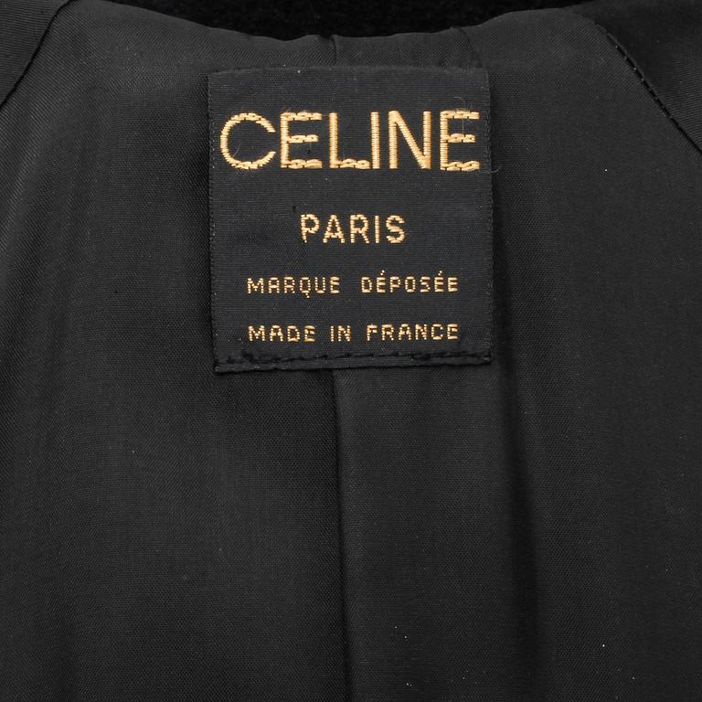 CÉLINE, a black cashmere and wool coat.