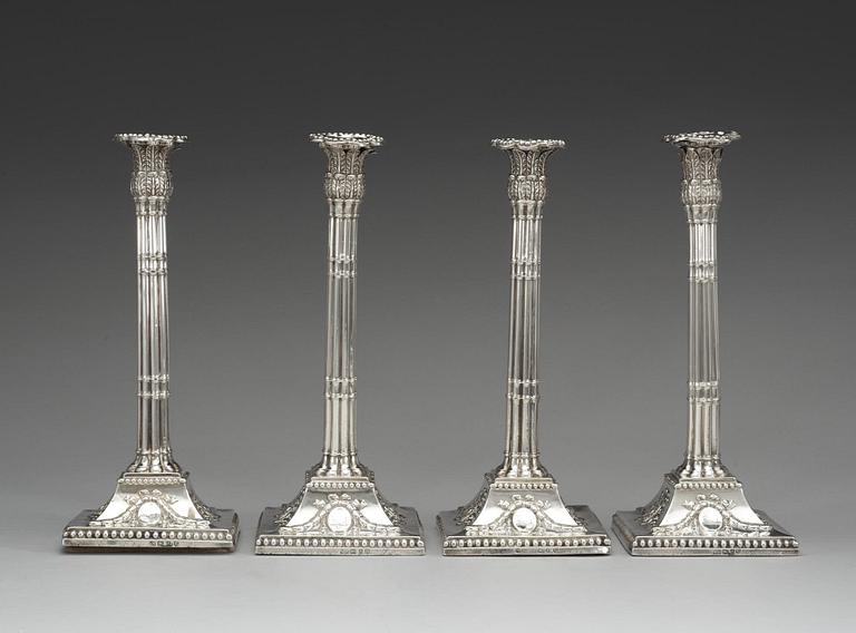 A set of four English silver candlesticks, marks of William Holmes, London 1772.