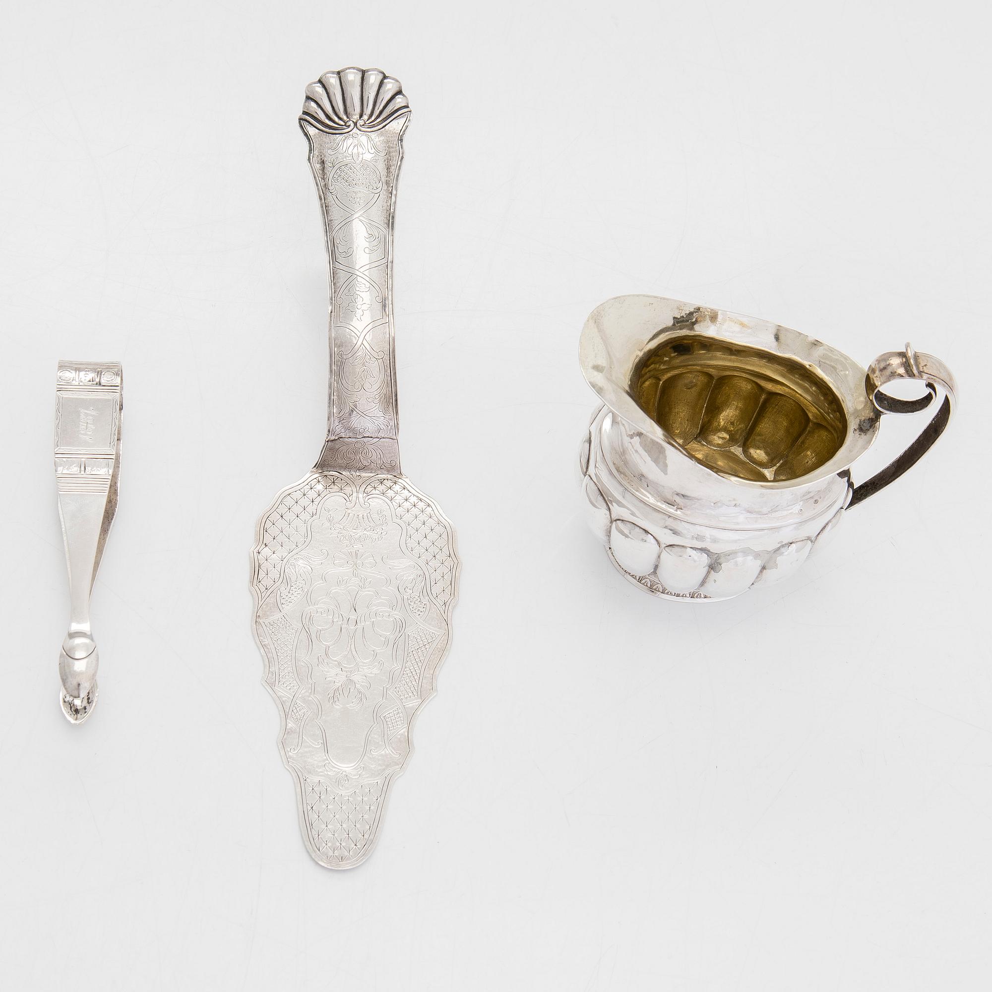 Cream jug, cake server, and sugar tongs in silver, Finland from latter part of the 18th century to 1854.