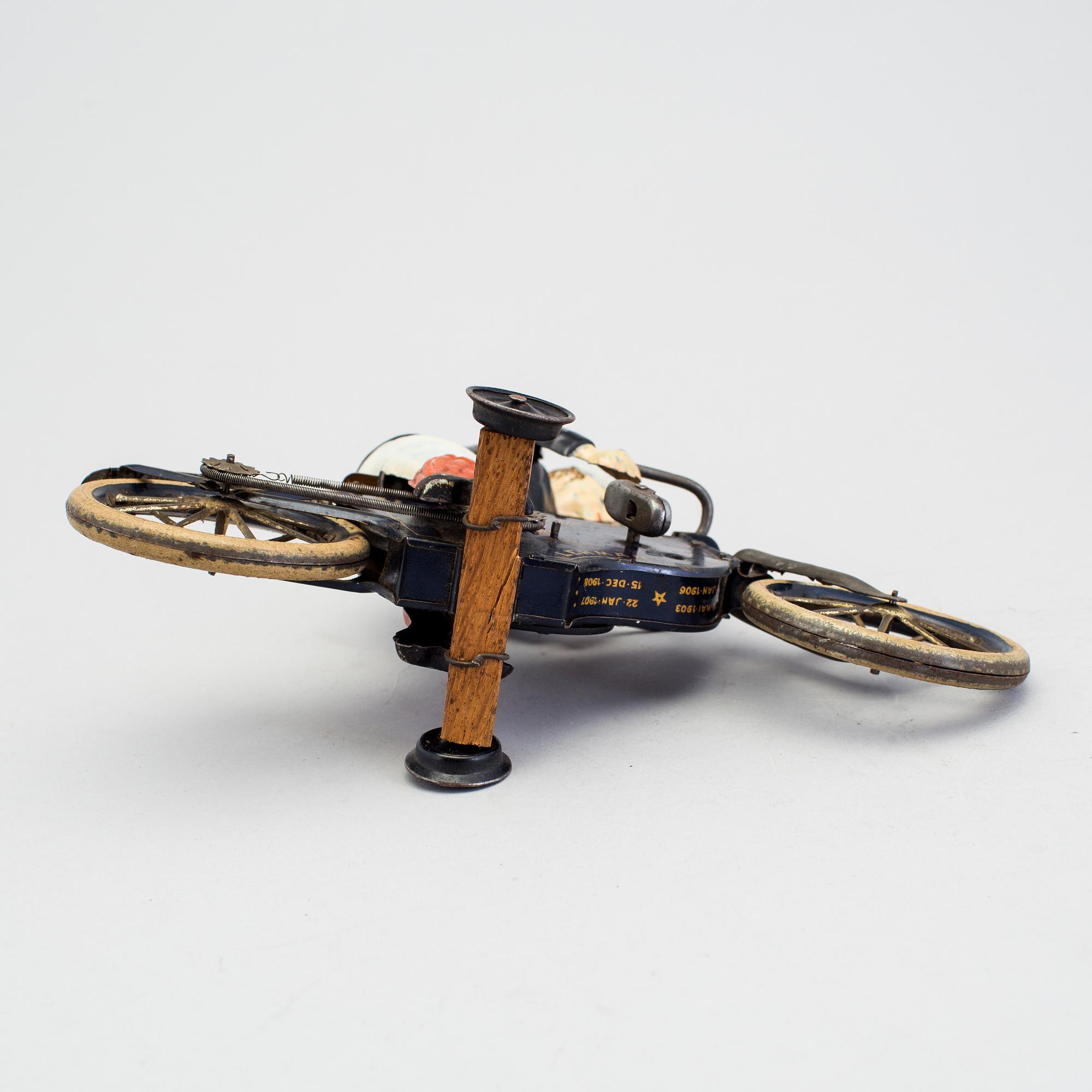 A partially hand painted tinplate Lehmann Halloh motorcycle, Germany. In production 1914-41.