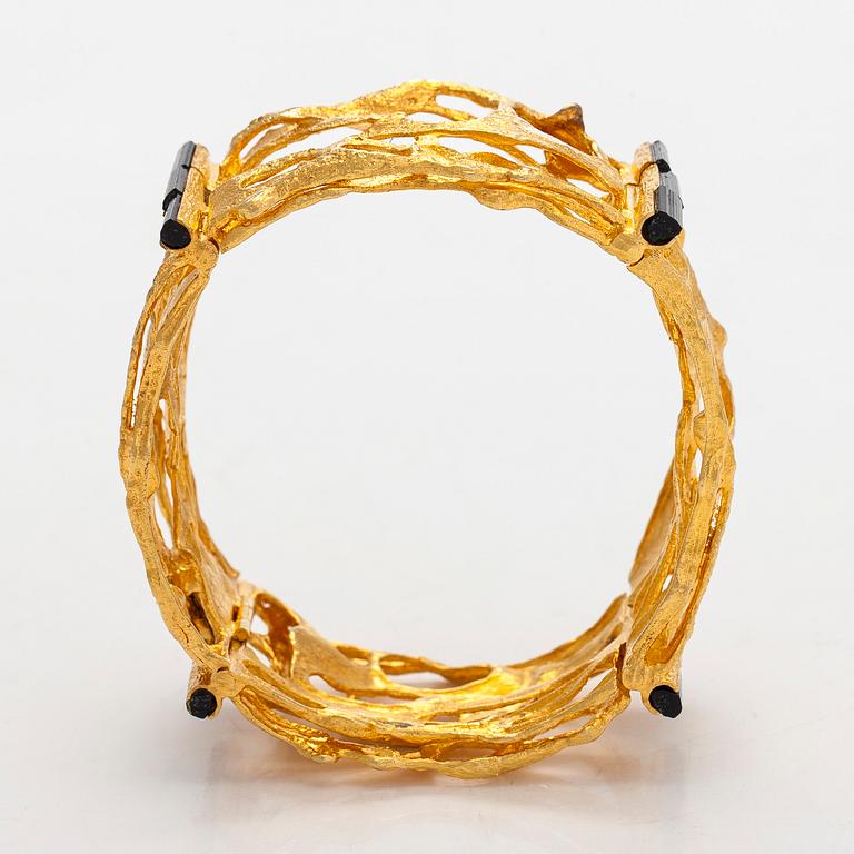 Björn Weckström, an 18K gold and tourmaline 'Sacrificial fire' bracelet. Lapponia 1971.