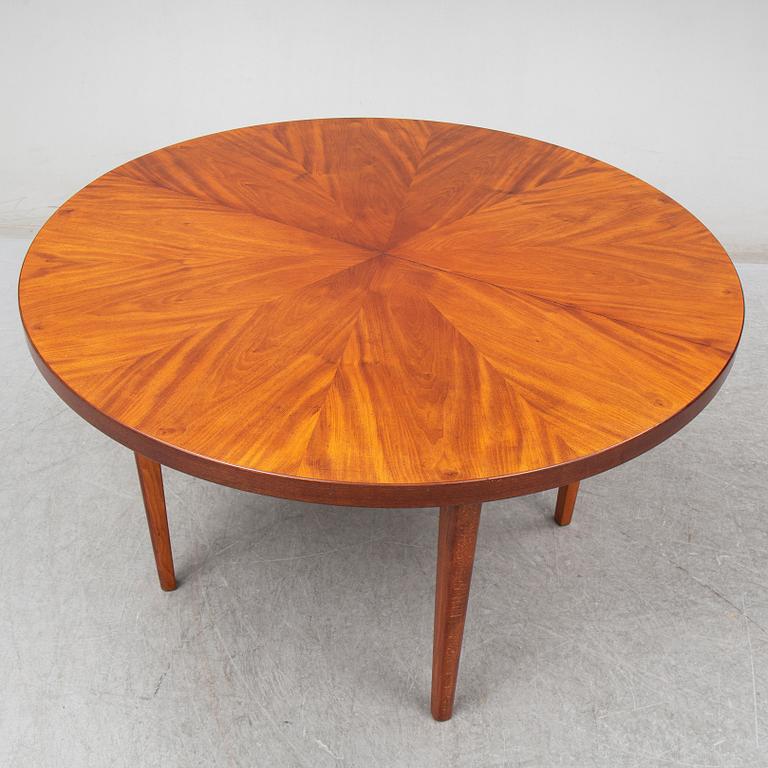 a mahogany dining table from the mid 20th century.