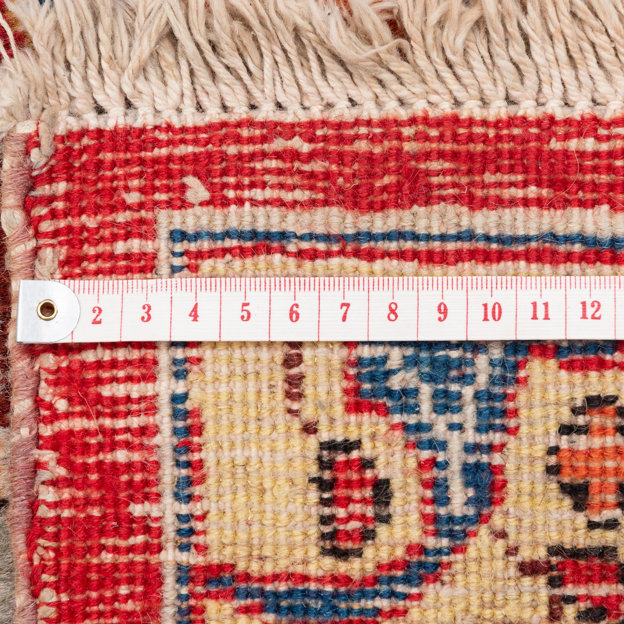 A semi-antique Tabriz carpet, c 358 x 248 cm.