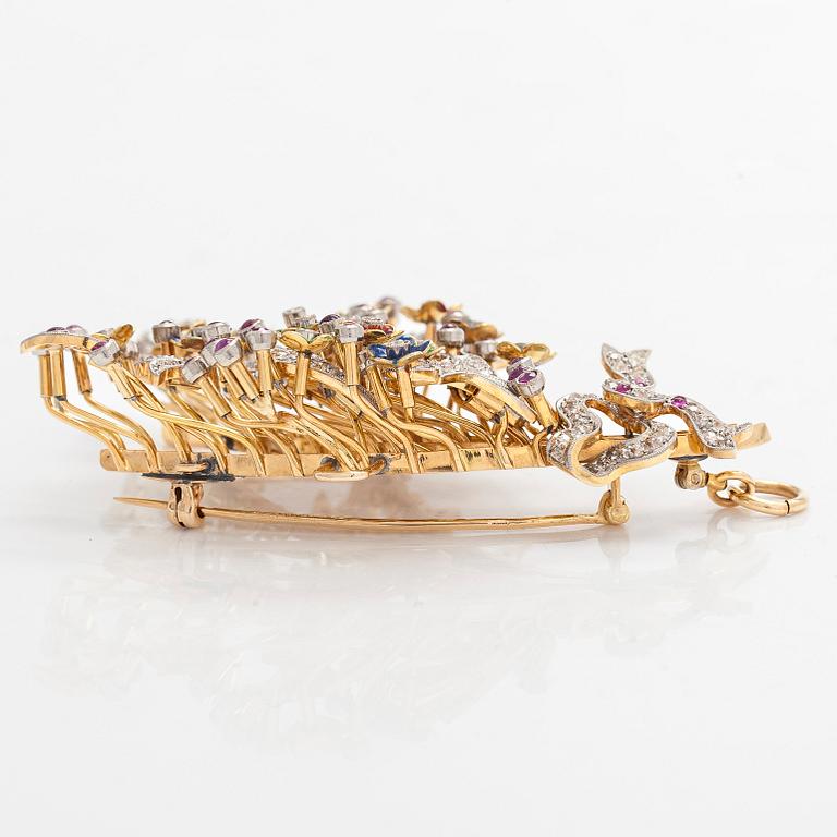 A 17K gold brooch/pendant with rose-cut diamonds, cabochon-cut rubies and enamel.
