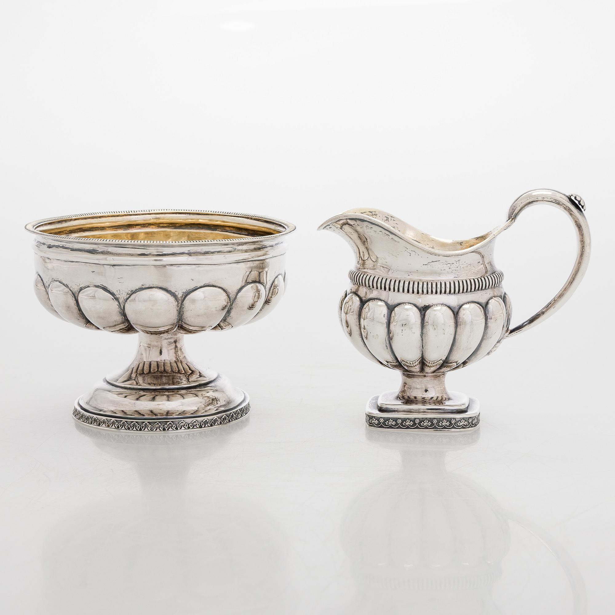 A silver cream jug by A.G. Illberg, Hamina, and a silver bonbonnière by Hj. Fagerroos, Helsingfors, 19th century.