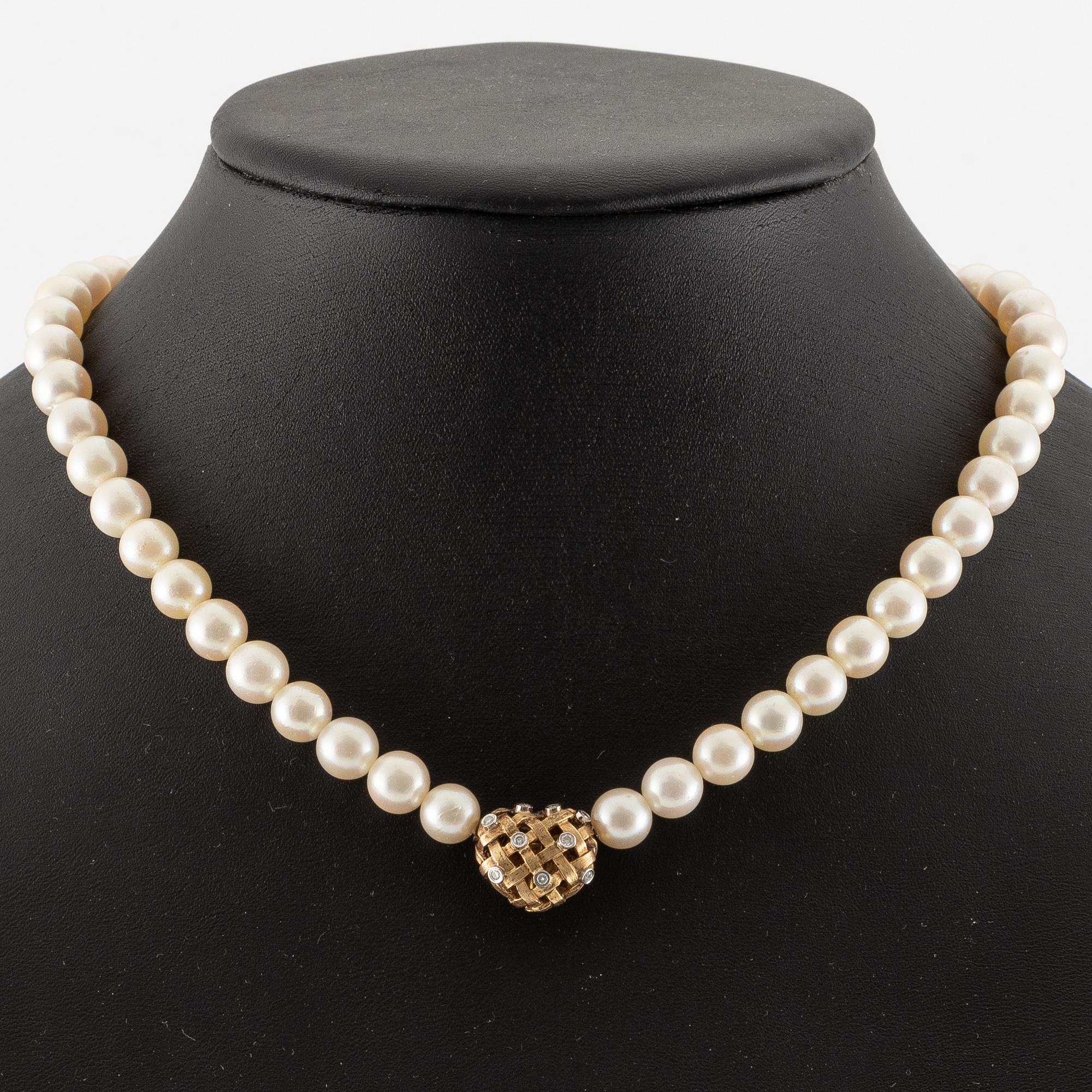 Ole Lynggard lås i form av ett hjärta 18K guld med runda briljantslipade diamanter.