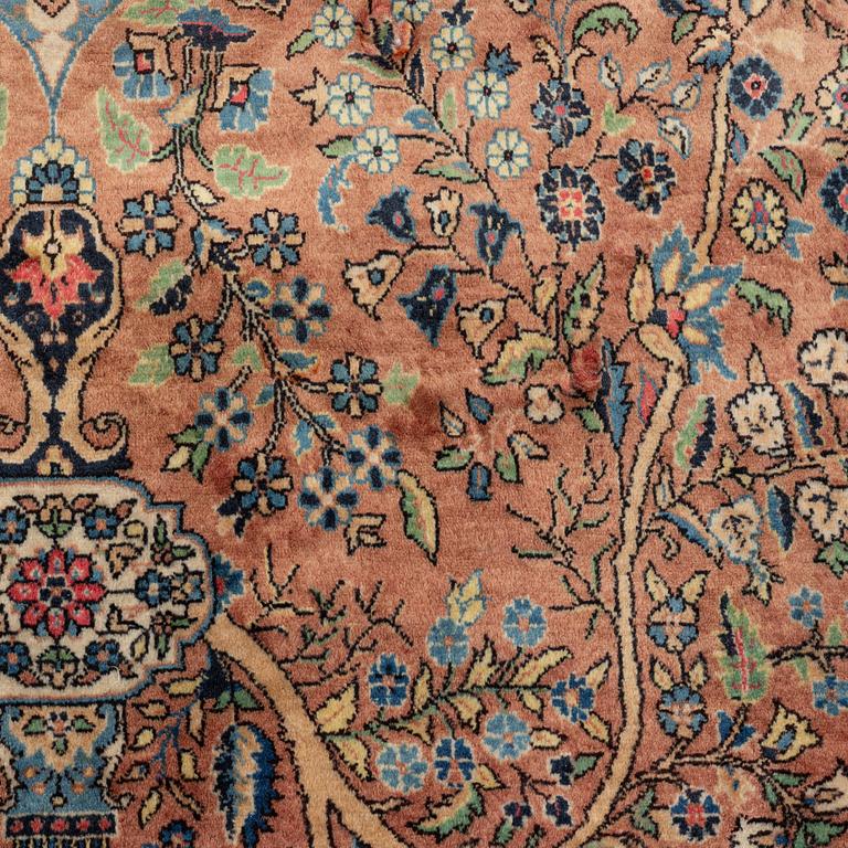 An oriental rug, circa 245 x 136 cm.