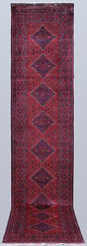 An Afghan runner, approx. 388 x 78 cm.