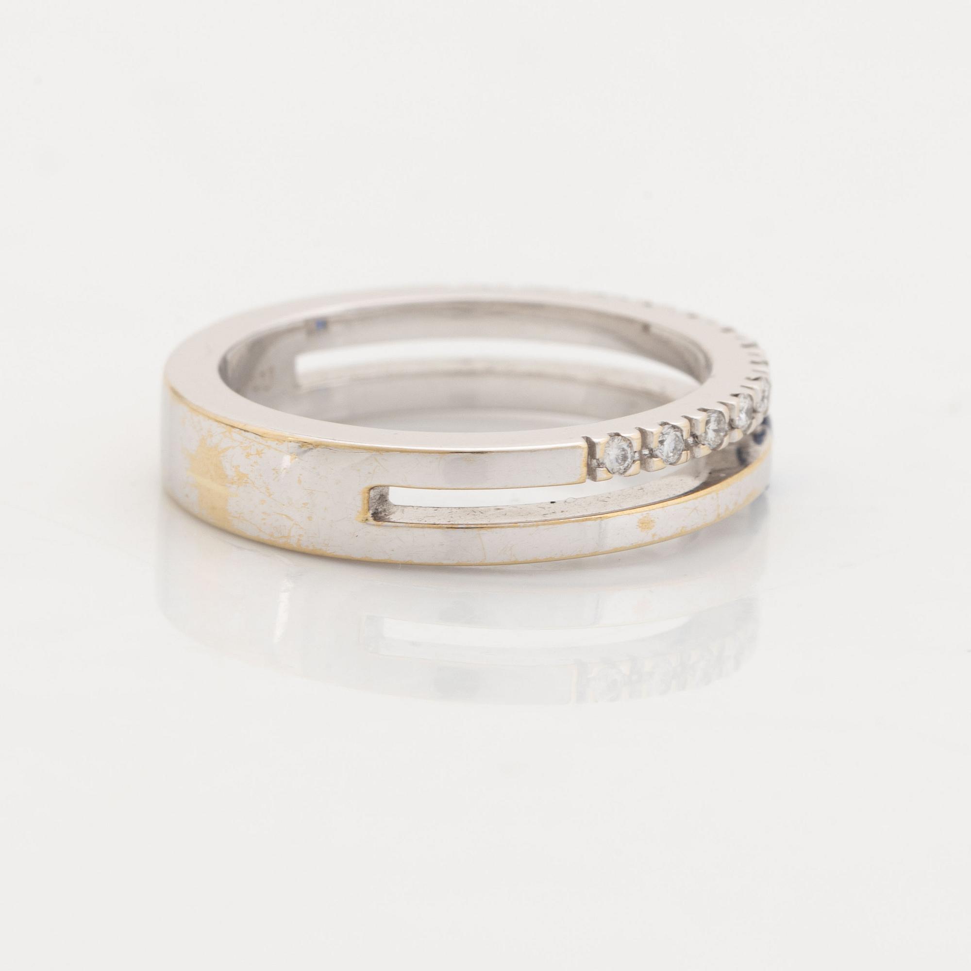 18K white, brilliant cut diamond and sapphire.