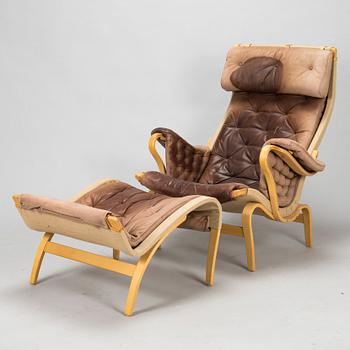 Bruno Mathsson, A "Pernilla" armchair with footstool, for DUX, designed in 1944.