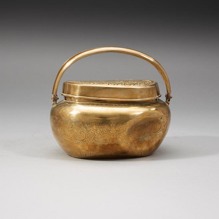 A Chinese engraved paktong hand warmer, Qing dynasty, 19th Century.