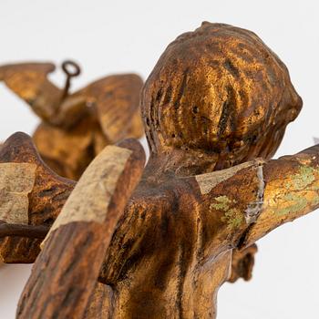 A pair of baroque wooden cupid sculptures, 18th century.