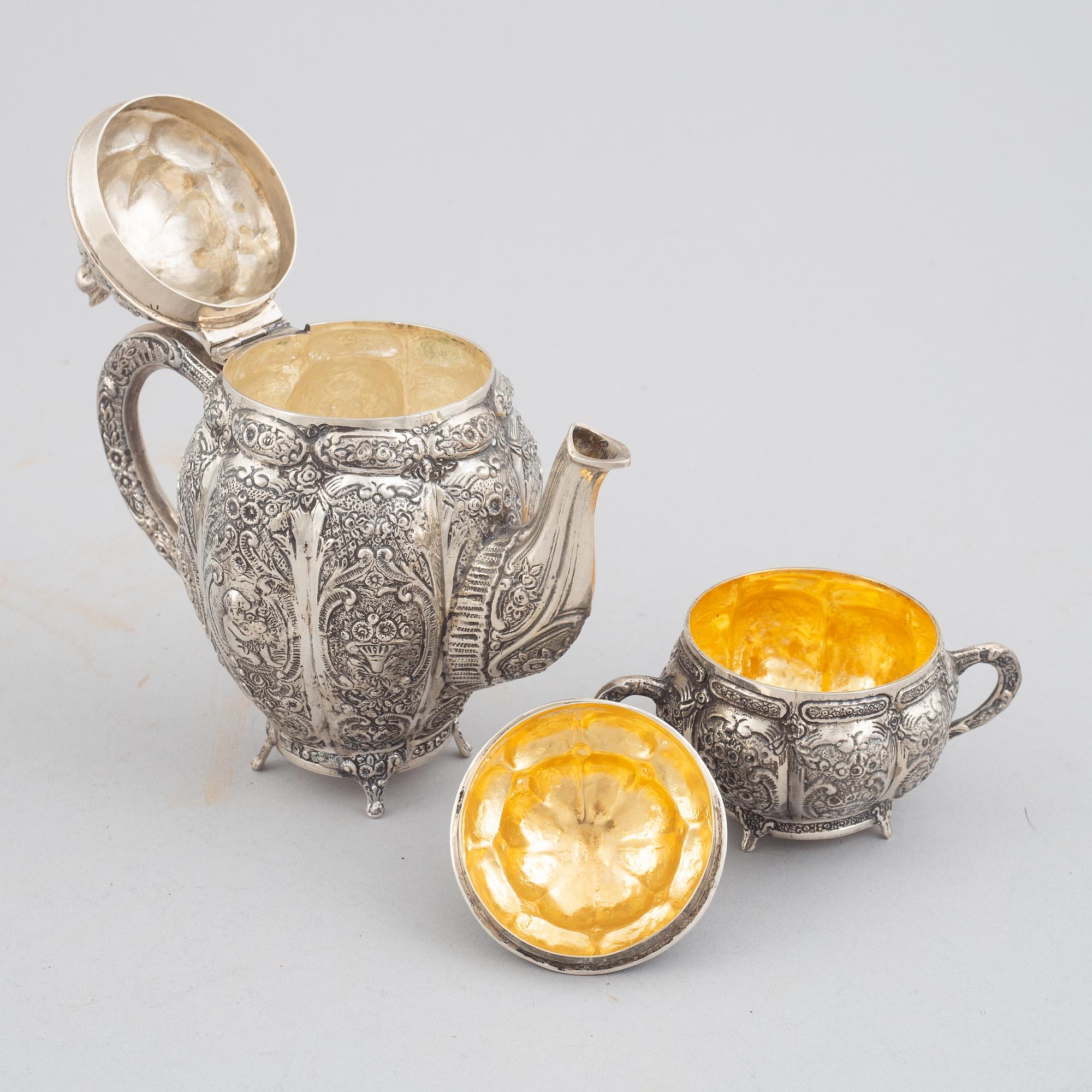 E.Jäntti, four silver cups, a three-piece silver coffee service and a silver tray, Helsinki, Finland,1979-81.