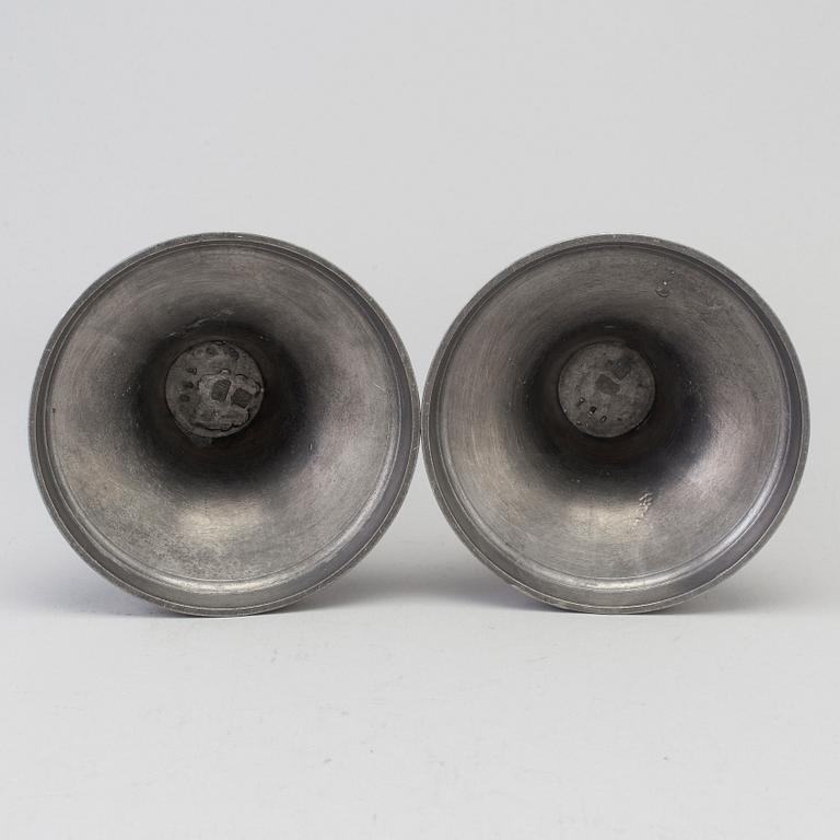 a pair of pewter candle sticks by B O Santesson Stockholm 1983.