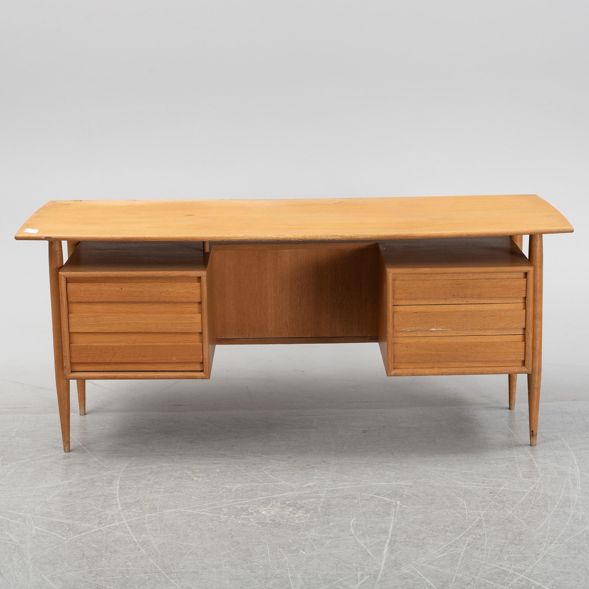 A teak veneered writing desk, 1950's/60's.