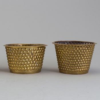 A set of four brass flower pots by Josef Frank for Firma Svenskt Tenn.