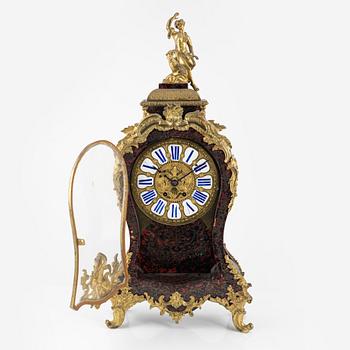 A faux tortoise and gilt bronze-mpunted Louis Xv-style cartel clock, late 19th century.