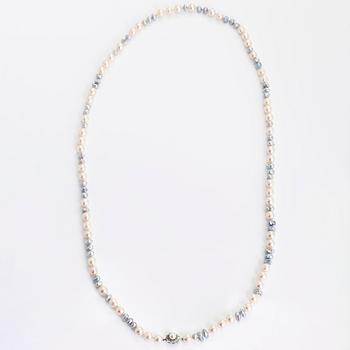 A cultured saltwater pearl necklace, clasp in 18K white gold with small emeralds.