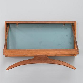 A mid-20th-Century Danish clothes rack by Adam Hoff & Poul Östergaard, Virum Möbelsnickeri.