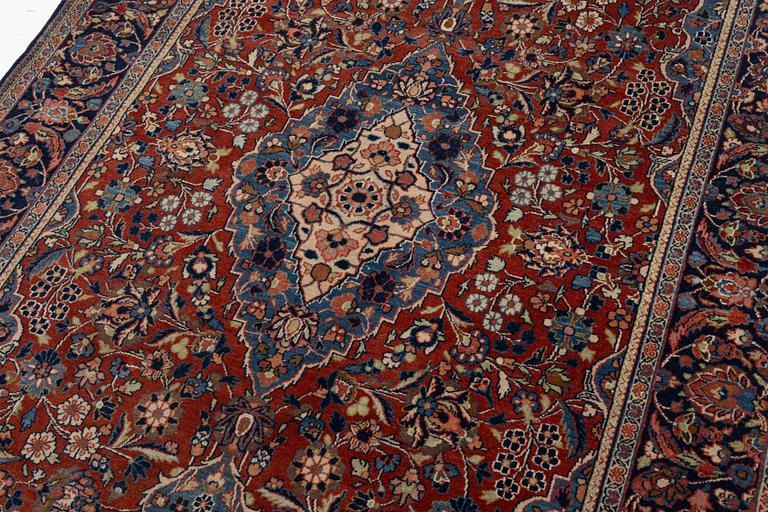 An Oriental rug, c. 195 x 132 cm.