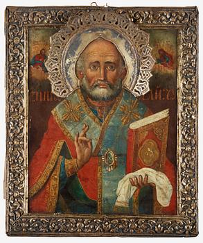 951. A Russian 19th century silver-gilt icon of St. Nicolaus.