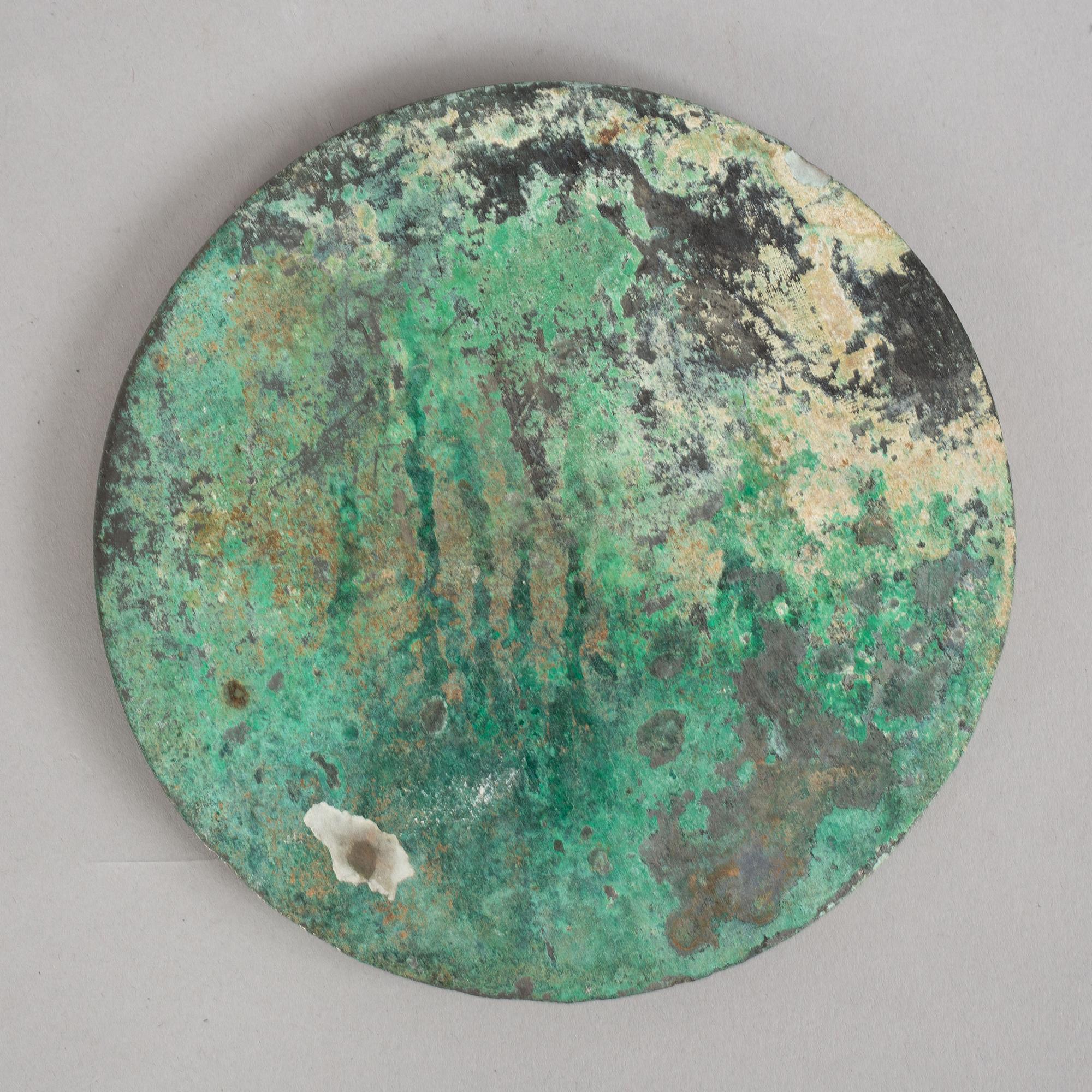A broze mirror, presumably Tang dynasty (618-907 A.D.).