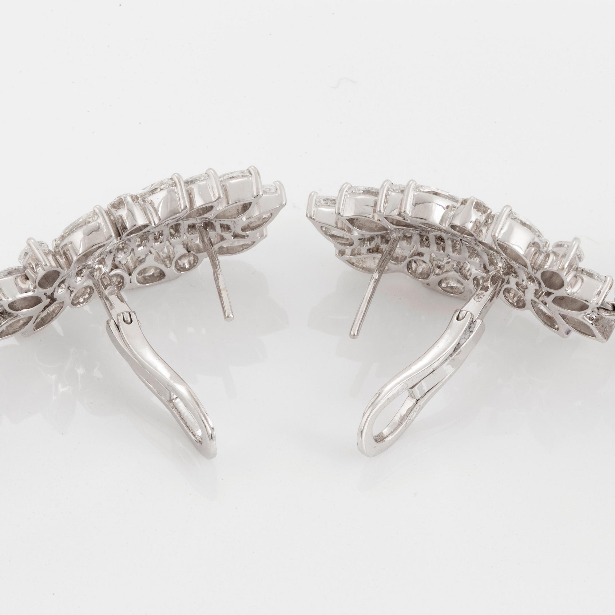 A pair of 18K gold tanzanite earings set with diamonds of various shapes.