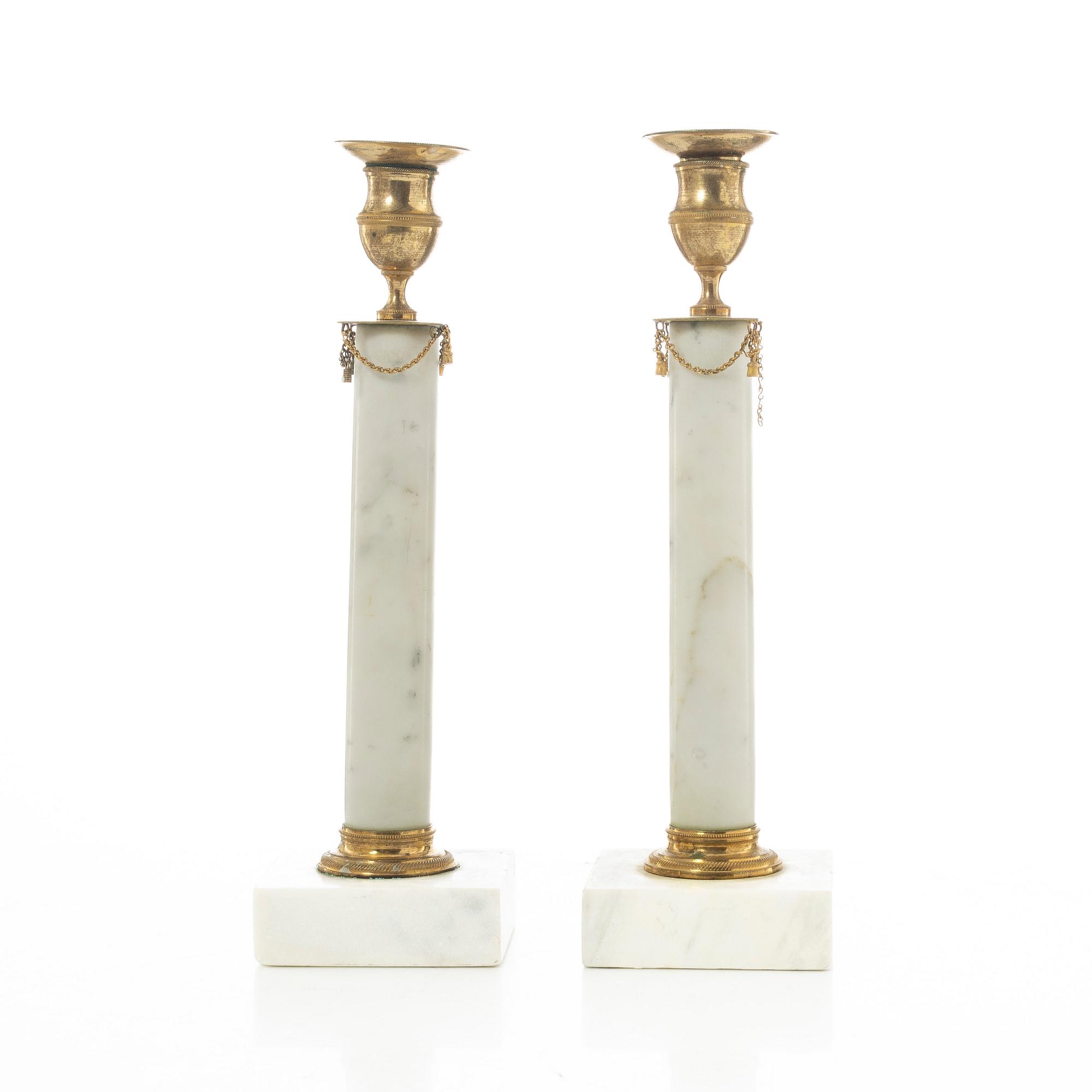A pair of late Gustavian gilt brass and marble candlesticks, circa 1800.