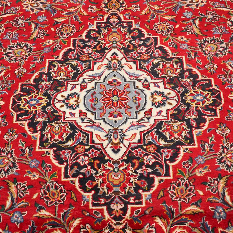 A Keshan rug, 345 x 236 cm.