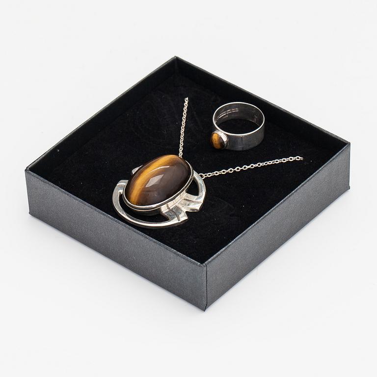 A silver ring and necklace with tiger's eye. Kultasepät Salovaara, Turku 1961.