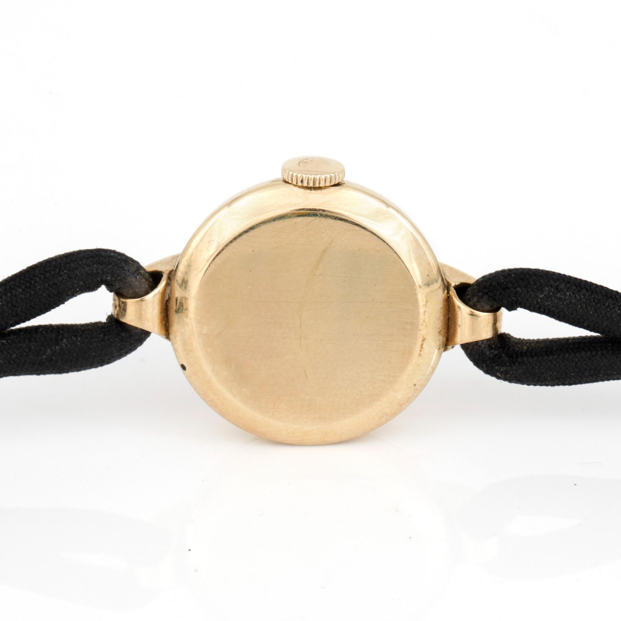 DAMARMBANDSUR, Omega, 1940-tal, boett 14 k guld.