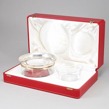 LES MUST DE CARTIER, a sterling silver and glass caviar bowl, Paris, France.