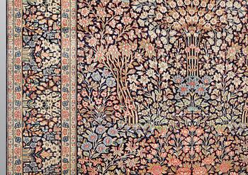 A 'Millefleur' Kerman Laver carpet, c. 410 x 290 cm.