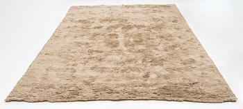 A monochrome carpet, 'Fallingwater - Mocha' by Layered, ca 400 x 300 cm.