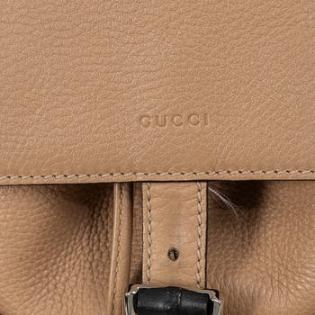 Gucci, a backpack.
