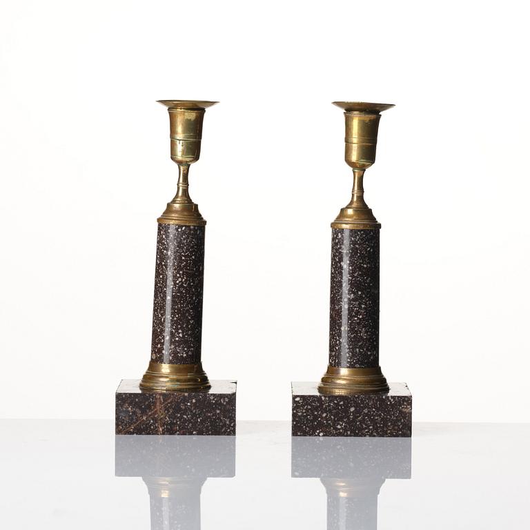 A pair of late Gustavian gilt-brass and 'Blyberg' porphyry candlesticks, Stockholm, circa 1800.