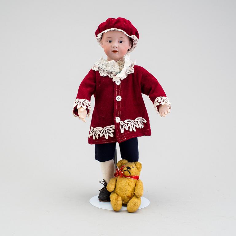 A bisque headed character boy doll, Germany, 1910s.