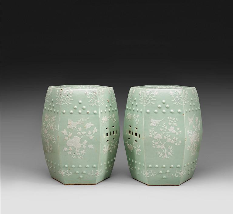 A pair of slip decorated celadon garden seats, Qing dynasty 19th century.