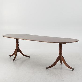 A dining table, 20th century, England.