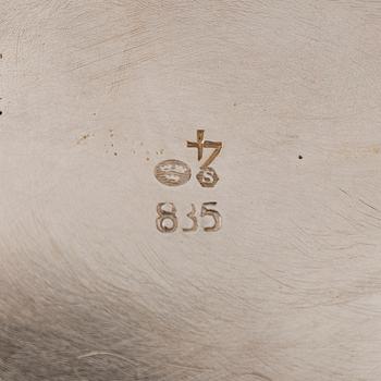 A three-piece silver coffee service, Swedish import marks. Silver sugar tongs, T.K. Alenius Vasa 1953.